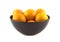 Tangerines in purple china bowl isolated
