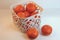 Tangerines in a white basket. Oranges in a basket