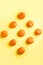 Tangerines on yellow background