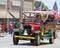 Tangier Shriners in jalopy in parade in small town America