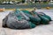 Tangled Pile of Fishing Nets Laying On Dock In Shipyard Harbor