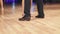 Tango dancers feet while dancing close-up