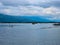 Tanguar Haor Houseboat sailing on the river near the India border in Bangladesh during the rainy season with the beautiful