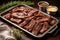 tangy beef ribs in a serving tray, with a silver serving set