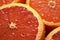 Tangy and refreshing, a close-up of sliced grapefruits