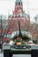 Tank covered by flowers on background of Moscow Kremlin. Unusual decorative elements on the Moscow street.