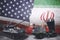 Tank and missile carrier in USA and Iran flags