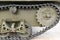 Tank tracks. Tank of the Second World War. Track armor close-up. Black track link and large rubberized rollers. Tank chassis. The