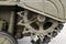 Tank tracks. Tank of the Second World War. Track armor close-up. Black track link and large rubberized rollers. Tank chassis. The