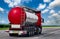 Tanker with chrome tanker on a large paved road