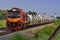 Tanker-freight train on the countryside railway