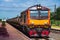 Tanker-freight train by diesel locomotive on the railway.