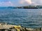 Tanker sailing on the Sea of â€‹â€‹Marmara to the Bosphorus against Istanbul cityscape in Turkey. A seagull stands on a stone