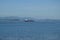 Tanker Ship Navigating The Estuary In Front Of The Horse Point Lighthouse On Arosa Island. Nature, Architecture, History, Travel.