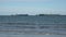 A tanker ship near an offshore drilling rig in Long Beach Harbor