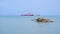 Tanker Ship And Rocks In The Middle Of The Sea Surface