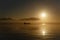 Tanker ship silhouetted on horizon at sunrise San Francisco Bay