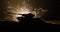 Tanks in the conflict zone. The war in the countryside. Tank silhouette at night. Battle scene.