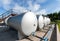 Tanks for storing crude oil at an oil well site.