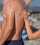 Tanned back of a man on the beach