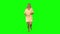 Tanned blond woman is running, waving, then stoped on green screen. Front view.
