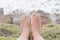 Tanned feet of a girl in a natural environment, on vacation, on the coast