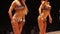 Tanned ladies in bikinis showing back pose at bodybuilding competition, fitness