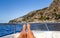 Tanned legs on boat on amalfitan coast