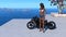 Tanned woman standing next to a motorcycle in a bikini top and shorts