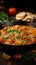Tantalizing chicken curry with aromatic spices, prepared in a wooden pan