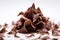 Tantalizing Macro Shot of Chocolate Shavings Unfurling from Block on White Background