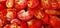 A tantalizing symphony of vibrant, crimson halved tomatoes, brimming with nature\\\'s bounty, enticing freshness