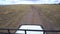 Tanzania, African Safari, Driving All-terrain Vehicle on Dusty Road POV