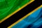 Tanzania country flag on silk or silky waving texture