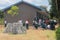 Tanzanian public high school students work in the school yard