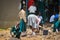 Tanzanian public high school students work in the school yard