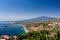 Taormina bay on a summer day with the Etna volcano
