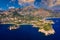 Taormina is a city on the island of Sicily, Italy. Mount Etna over Taormina cityscape, Messina, Sicily. View of Taormina located