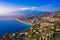 Taormina is a city on the island of Sicily, Italy. Mount Etna over Taormina cityscape, Messina, Sicily. View of Taormina located