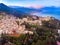 Taormina landscape and ruins of theater, Sicily Italy sunset, volcano Etna in clouds. Aerial top view