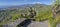 Taormina - The path among the spring mediterranean flowers and the Mt. Etna volcano