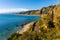 Taormina shore at Ionian sea with Giardini Naxos and Villagonia towns and Mount Etna in Messina region of Sicily in Italy