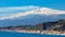 Taormina shore at Ionian sea with Giardini Naxos and Villagonia towns and Mount Etna in Messina region of Sicily in Italy