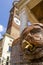 A tap of a antique medieval drinking fountain in the street of Verona, Italy