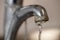 Tap limescale. Selective focus on the hard water deposit of a ru