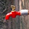 A tap with mineral water on the street in old delhi area Chandni Chowk in New Delhi, India, Delhi Street Photography