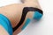 Tape bandage on a woman`s leg. Tape adhesive tape for sports medicine