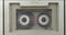Tape recorder rewinding audio cassette inserted therein. Rewind and stop audio cassette. Vintage audio tape.