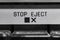 Tape Recorder Stop and Eject Button Macro Detail