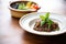 tapenade in a clay dish with a side of fresh basil